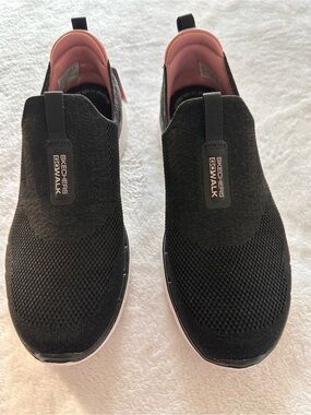 Skechers Women’s Black Glimmer Slip-On Sneakers with Pink Lining